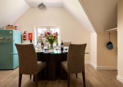 Upper Wing is a large, luxury and dog-friendly holiday apartment with a tennis court on a private estate near the North Norfolk coast | Gresham Hall Estate