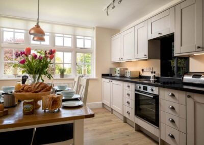 Middle Wing is a large, luxury and dog-friendly holiday apartment with a tennis court on a private estate near the North Norfolk coast | Gresham Hall Estate